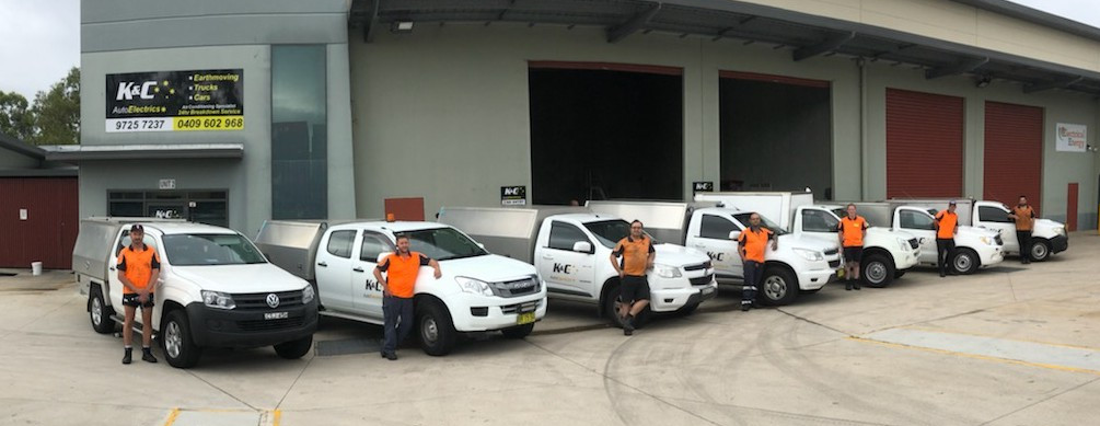 The K&C Auto Electrics team lined up in front of their mobile units