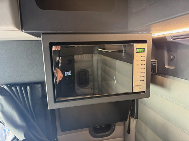 Microwave installed in truck sleeper cab — K&C Auto Electrics driver comfort fit out
